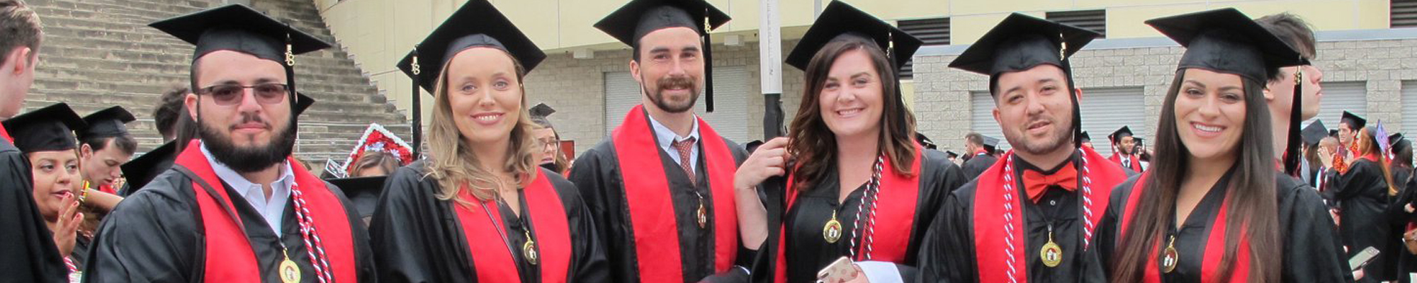 group of graduates in cap and gown